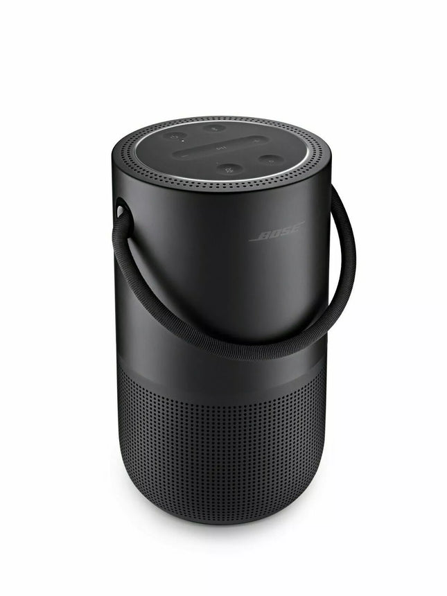 Black portable speaker with handle on a white background